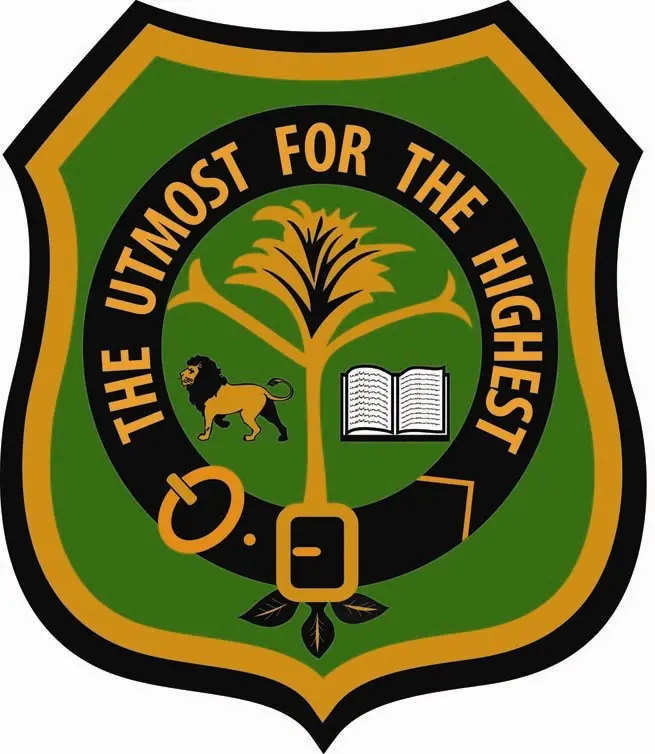 A green and yellow shield with an image of a tree.